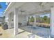 Outdoor pool house with ceiling fans, tables and chairs, perfect for hosting gatherings at 824 Forrest Dr, Charleston, SC 29492