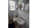 Bathroom featuring a pedestal sink, toilet, and window with natural light at 824 Orangeburg Rd, Summerville, SC 29483
