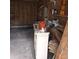 A peek inside this garage with wood paneling and ample storage on wooden shelves at 824 Orangeburg Rd, Summerville, SC 29483