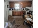 Features wooden cabinets and an eat-in table, offering a cozy space for casual dining at 824 Orangeburg Rd, Summerville, SC 29483
