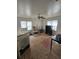 Spacious living room features a ceiling fan and natural light from two windows at 824 Orangeburg Rd, Summerville, SC 29483