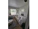 A bright living room with a large window and a comfortable sofa with neutral decor at 824 Orangeburg Rd, Summerville, SC 29483