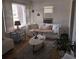 Inviting living room featuring a comfortable sofa, window, and stylish décor at 824 Orangeburg Rd, Summerville, SC 29483