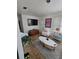 Open-concept living room featuring a gray rug, TV, front door and accent chair at 824 Orangeburg Rd, Summerville, SC 29483