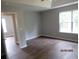 Bright bedroom with hardwood flooring and a large window, offering a serene living space at 8309 Berringer Bluff, North Charleston, SC 29418