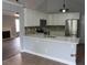 Modern kitchen with stainless steel appliances, white cabinets, and an island counter at 8309 Berringer Bluff, North Charleston, SC 29418