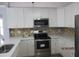 Kitchen featuring stainless steel appliances and white cabinets at 8309 Berringer Bluff, North Charleston, SC 29418