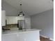 Stylish kitchen showcases white cabinets, a center island with stainless steel appliances at 8309 Berringer Bluff, North Charleston, SC 29418