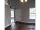 Living room featuring wood floors, a door, and a window at 8309 Berringer Bluff, North Charleston, SC 29418