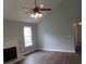 Spacious living room with wood floors, ceiling fan and a fireplace at 8309 Berringer Bluff, North Charleston, SC 29418