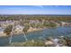 Expansive aerial view captures the neighborhood homes nestled among the waterway and private docks, blending nature and community at 886 Piccadilly Cir, Charleston, SC 29412