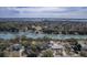 Wide aerial of waterfront community featuring docks, mature landscaping, and tranquil bay views against an expansive horizon at 886 Piccadilly Cir, Charleston, SC 29412