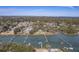 Expansive aerial view captures the neighborhood homes nestled among the waterway and private docks, blending nature and community at 886 Piccadilly Cir, Charleston, SC 29412