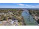 Expansive aerial view captures the neighborhood homes nestled among the waterway and private docks, blending nature and community at 886 Piccadilly Cir, Charleston, SC 29412