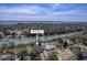 Aerial view of bay with address marker over waterfront home featuring private docks and lush green surroundings at 886 Piccadilly Cir, Charleston, SC 29412
