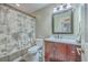 Cozy bathroom featuring a wooden vanity, modern fixtures, and stylish patterned shower curtain at 886 Piccadilly Cir, Charleston, SC 29412