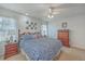 Charming bedroom featuring a full bed, ceiling fan, decor, and a large window at 886 Piccadilly Cir, Charleston, SC 29412