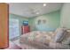 Comfortable bedroom showcasing a full bed, TV, ceiling fan, and a bright window at 886 Piccadilly Cir, Charleston, SC 29412
