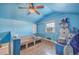 Unique bedroom featuring blue walls, a fun snowman, a ceiling fan, and lots of storage at 886 Piccadilly Cir, Charleston, SC 29412