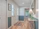 Welcoming foyer featuring hardwood floors, wainscotting and a stylish entryway table at 886 Piccadilly Cir, Charleston, SC 29412