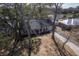 Brick home with a covered porch, garage, and mature trees, showcasing a classic and welcoming facade at 886 Piccadilly Cir, Charleston, SC 29412