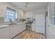 Bright kitchen with white cabinets, stainless steel appliances, and ample counter space for cooking at 886 Piccadilly Cir, Charleston, SC 29412