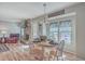 Open-concept dining room and living room with a fireplace and wood floors offer versatile living at 886 Piccadilly Cir, Charleston, SC 29412