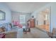 Cozy living room with comfortable seating, natural light, and a glimpse into the home's inviting entryway at 886 Piccadilly Cir, Charleston, SC 29412