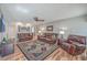 Spacious living room with leather sofas, hardwood floors, and plenty of natural light at 886 Piccadilly Cir, Charleston, SC 29412