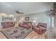 Comfortable living room featuring leather sofas, hardwood floors, and a cozy ambiance at 886 Piccadilly Cir, Charleston, SC 29412