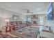 Cozy living room featuring a brick fireplace, comfortable leather furniture, and a ceiling fan at 886 Piccadilly Cir, Charleston, SC 29412