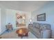 Serene living room with soft lighting and a large window offers views into the home's well-kept layout at 886 Piccadilly Cir, Charleston, SC 29412