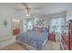 Spacious main bedroom with matching dressers, stylish decor, and ensuite bathroom at 886 Piccadilly Cir, Charleston, SC 29412
