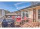 Cozy outdoor deck area with seating and a grill, perfect for entertaining or relaxing under the sun at 886 Piccadilly Cir, Charleston, SC 29412