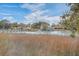 Scenic waterfront view showcasing a serene river, docks, and charming homes along the coastline at 886 Piccadilly Cir, Charleston, SC 29412