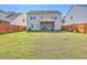 Large backyard with lush grass, and fenced perimeter at 9988 Winged Elm St, Ladson, SC 29456