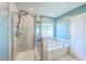 Updated bathroom featuring a shower and a soaking tub with a window at 9988 Winged Elm St, Ladson, SC 29456