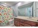 The bathroom includes a large mirror, stylish vanity, and a colorful mermaid-themed shower curtain at 9988 Winged Elm St, Ladson, SC 29456