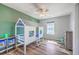 Cozy bedroom featuring a house frame bed, a ceiling fan, and natural light at 9988 Winged Elm St, Ladson, SC 29456