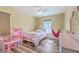 Stylish bedroom with a bed, a pink doll house, and a pink hanging swing at 9988 Winged Elm St, Ladson, SC 29456