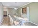 Charming dining room featuring a farmhouse table and natural light from multiple windows at 9988 Winged Elm St, Ladson, SC 29456
