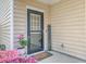 Inviting front door with flowers and a welcome sign that says there's no place like home at 9988 Winged Elm St, Ladson, SC 29456