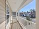 Inviting front porch overlooking the street with white railings and nice neighborhood views at 9988 Winged Elm St, Ladson, SC 29456