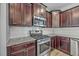Close-up of the kitchen features stainless steel stove and subway tile backsplash, and granite counters at 9988 Winged Elm St, Ladson, SC 29456