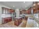 Modern kitchen featuring granite countertops, stainless steel appliances, and a central island at 9988 Winged Elm St, Ladson, SC 29456