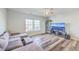 Relaxing living room with wood floors, sectional sofa, and plenty of natural light at 9988 Winged Elm St, Ladson, SC 29456