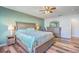 This primary bedroom offers natural light, a ceiling fan, and two matching dressers at 9988 Winged Elm St, Ladson, SC 29456