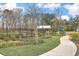 Community playground with a covered picnic area, walking path, and lush landscaping at 9988 Winged Elm St, Ladson, SC 29456
