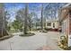 Well-maintained backyard with mature trees and a patio great for entertaining at 100 Lakeview Dr, Summerville, SC 29485