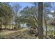 Elevated view of a serene backyard with a lake and a delightful gazebo at 100 Lakeview Dr, Summerville, SC 29485